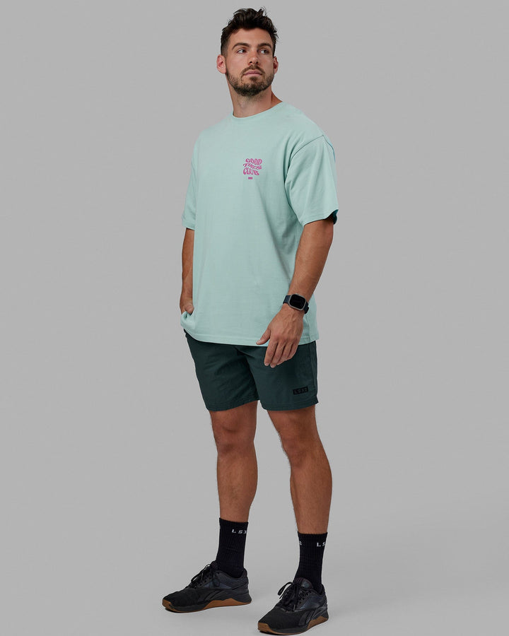 Man wearing Unisex Good Times Heavyweight Tee Oversize - Pastel Turquoise-Spark Pink