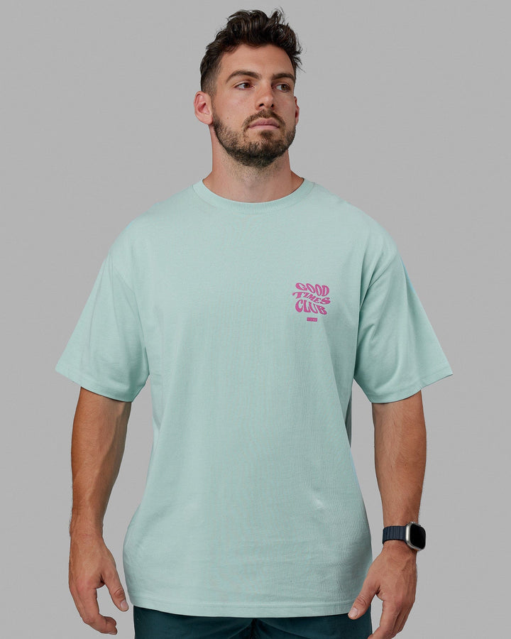 Man wearing Unisex Good Times Heavyweight Tee Oversize - Pastel Turquoise-Spark Pink