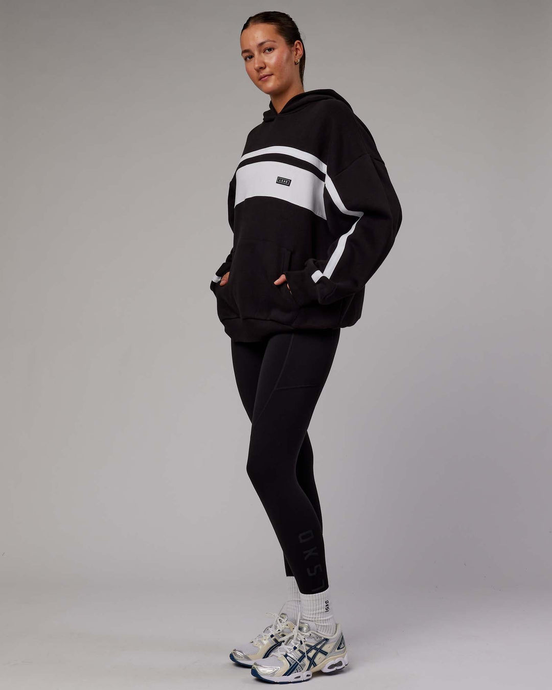 Woman wearing Unisex Intercept Hoodie Oversize - Black-White