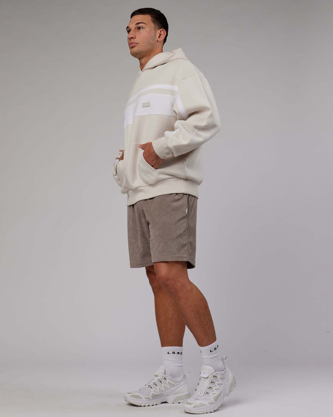 Man wearing Unisex Intercept Hoodie Oversize - Clay-White