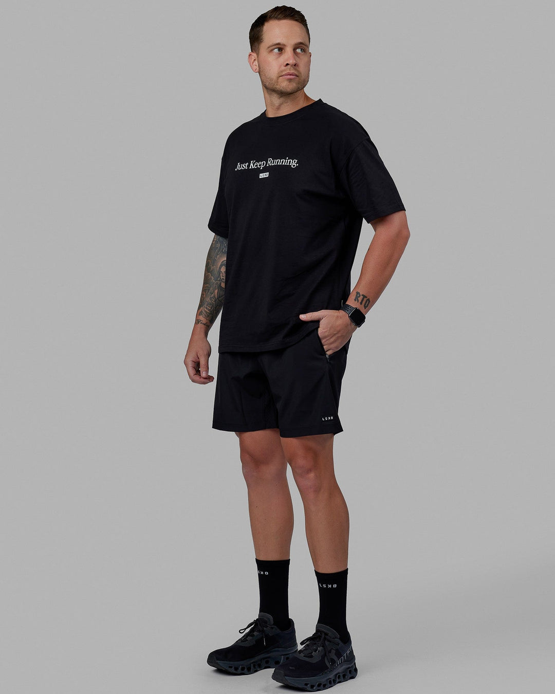 Man wearing Unisex Just Keep Running FLXCotton Tee Oversize - Black-White