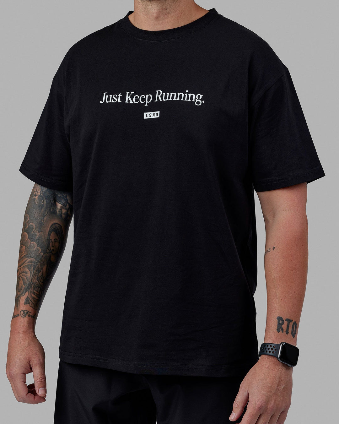 Man wearing Unisex Just Keep Running FLXCotton Tee Oversize - Black-White