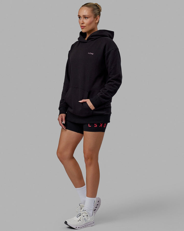 Woman wearing Unisex Lift-Up Hoodie Oversize - Black