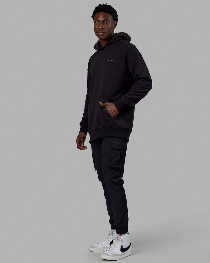 Man wearing Unisex Lift-Up Hoodie Oversize - Black