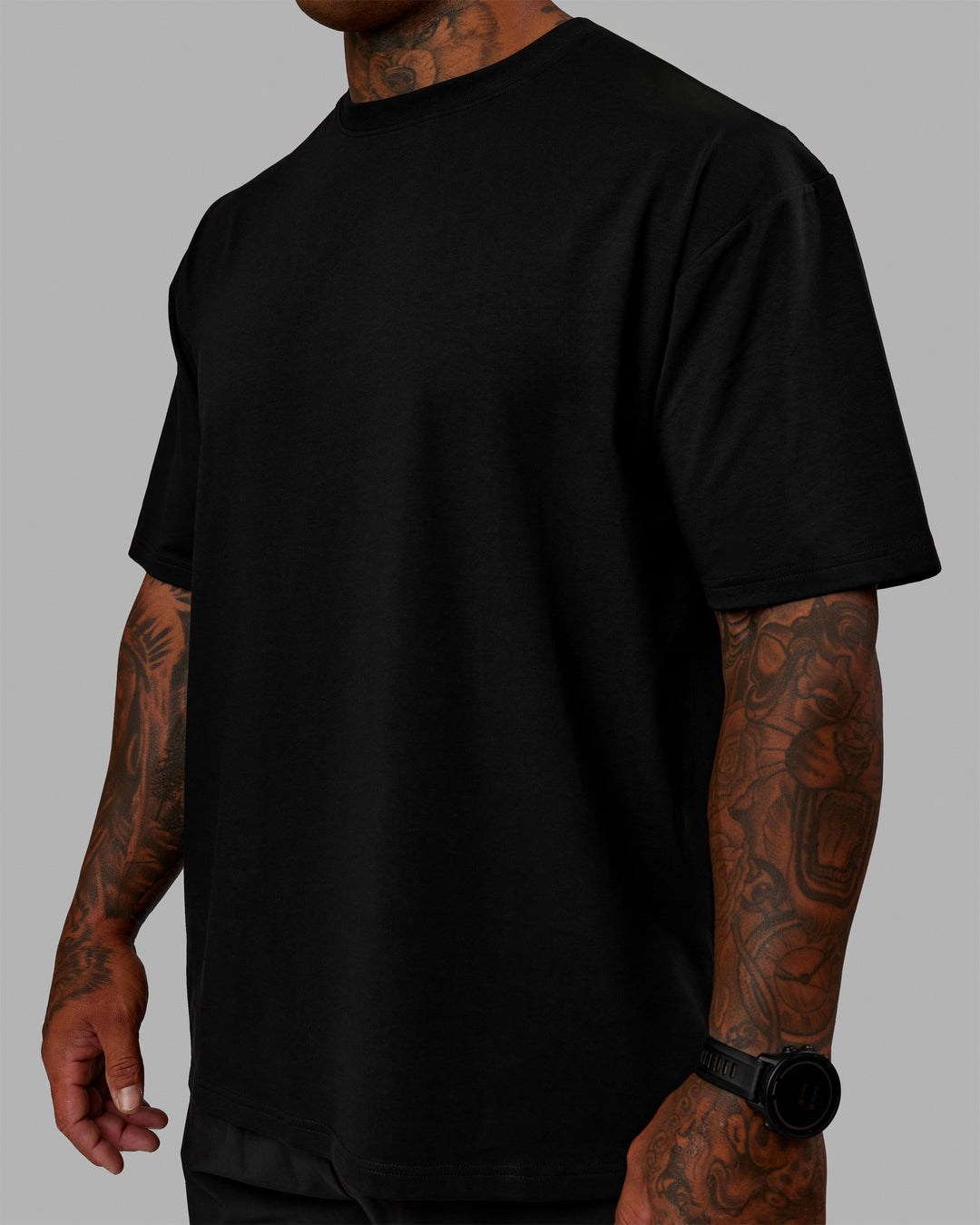 Man wearing Unisex Lifting Club FLXCotton Tee Oversize - Black-Black