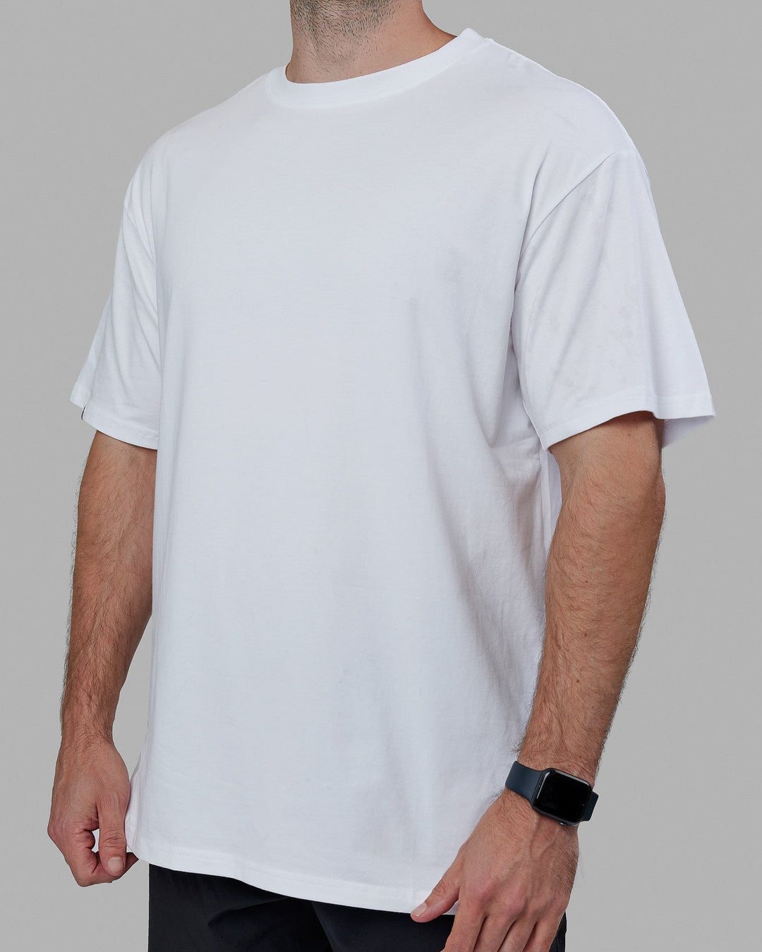 Man wearing Lifting Club FLXCotton Tee Oversize - White-Power Cobalt-Black