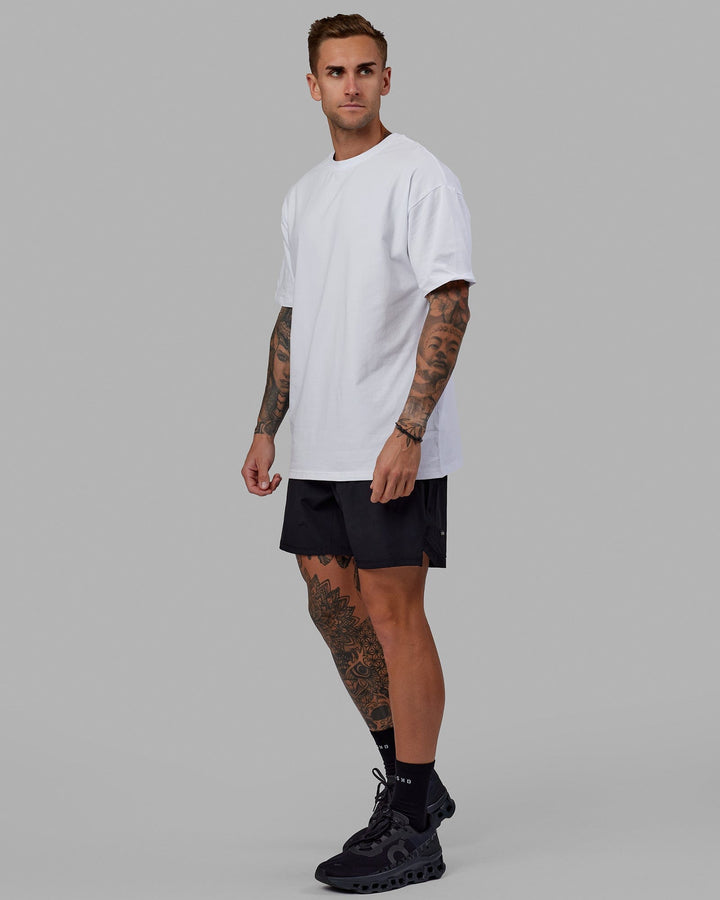 Man wearing Unisex Love The Run FLXCotton Tee Oversize - White-Black