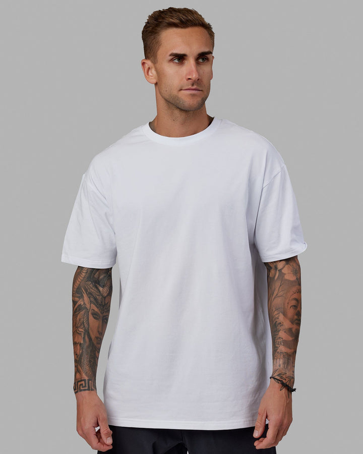 Man wearing Unisex Love The Run FLXCotton Tee Oversize - White-Black