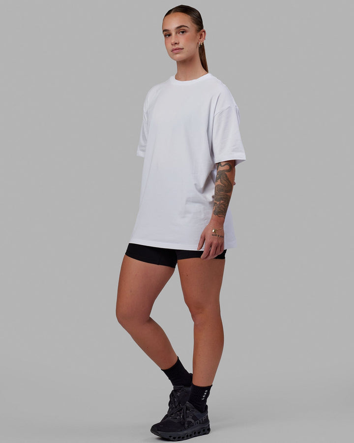 Woman wearing Unisex Love The Run FLXCotton Tee Oversize - White-Black
