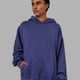 Man wearing Unisex Love The Run Hoodie Oversize - Future Dusk-Galactic Lilac
