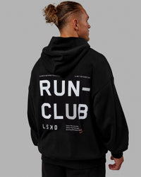 Man wearing Unisex Love The Run Hoodie Oversize - Black-White