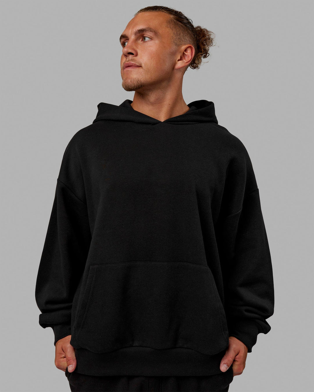 Man wearing Unisex Love The Run Hoodie Oversize - Black-White