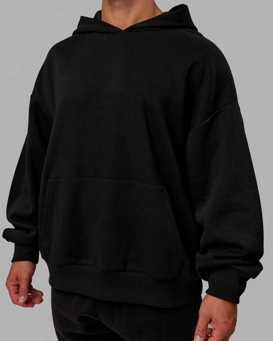 Man wearing Unisex Love The Run Hoodie Oversize - Black-White