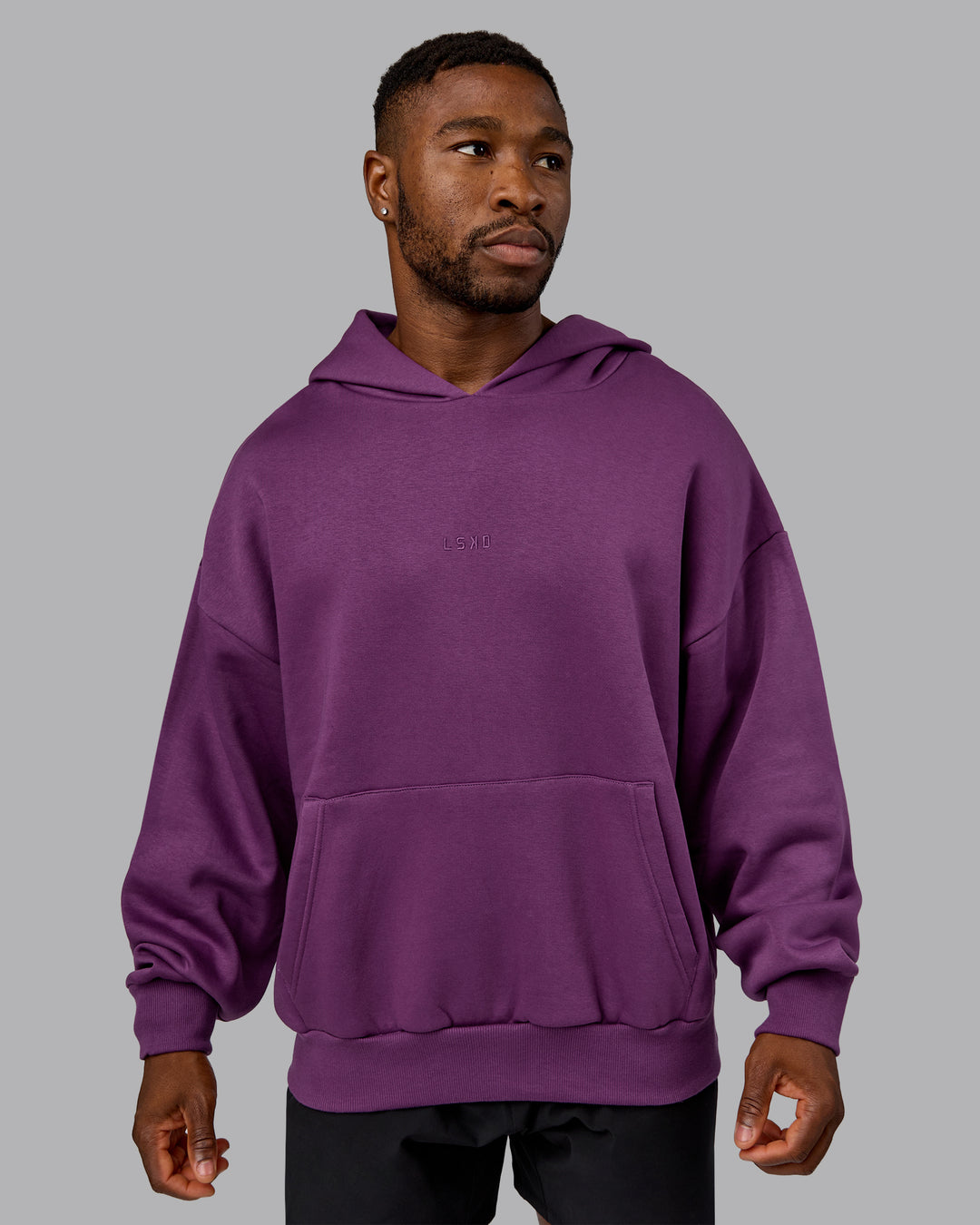 Man wearing MVP Oversized Hoodie - Deep Purple | Model:Sam | Size:L
