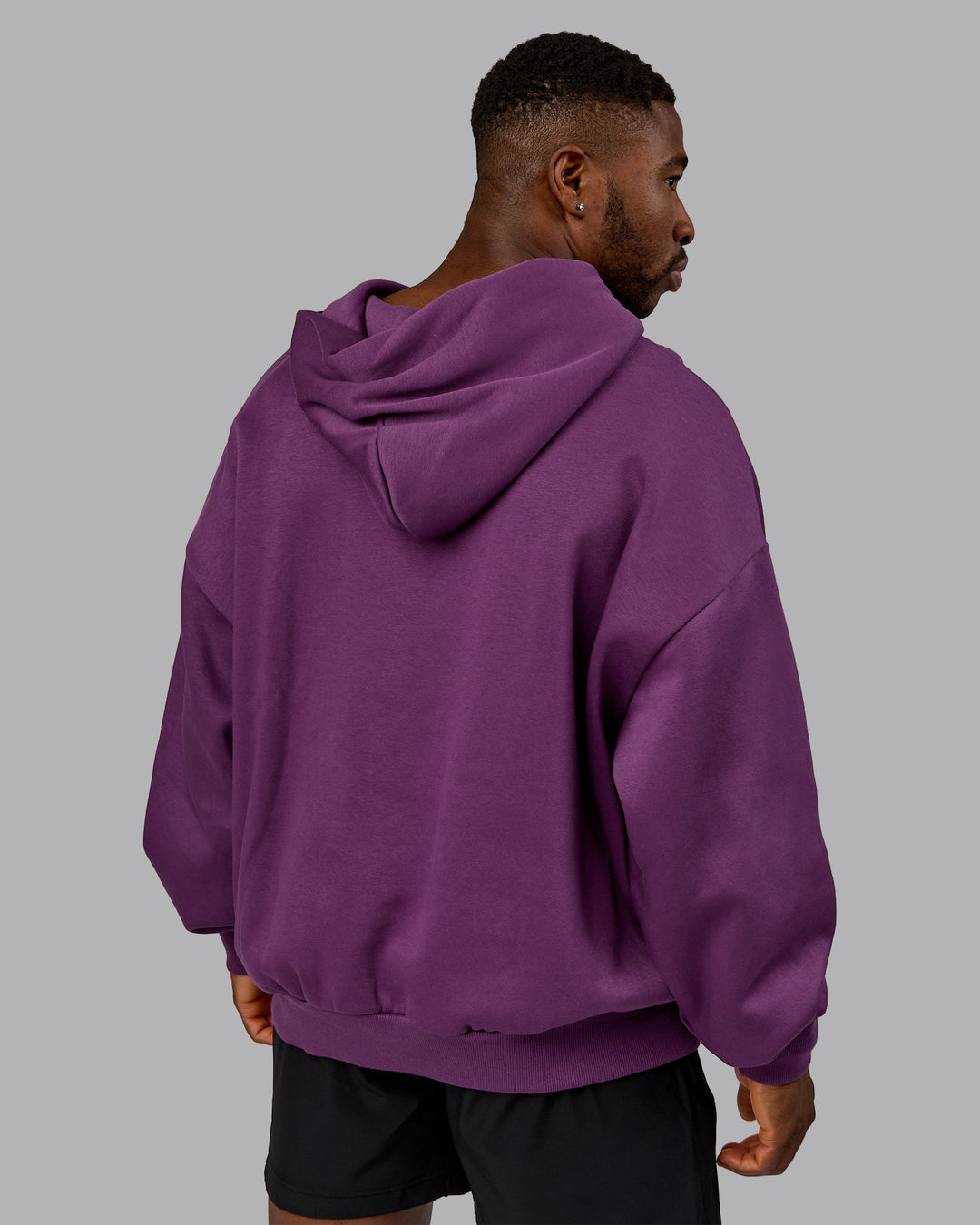 Man wearing MVP Oversized Hoodie - Deep Purple | Model:Sam | Size:L