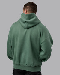 Man wearing Unisex MVP Hoodie Oversize - Sage Brush