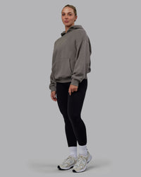 Woman wearing Unisex MVP Hoodie Oversize - Storm Front