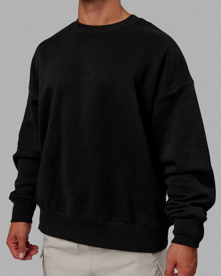 Man wearing Unisex MVP Sweater Oversize - Black