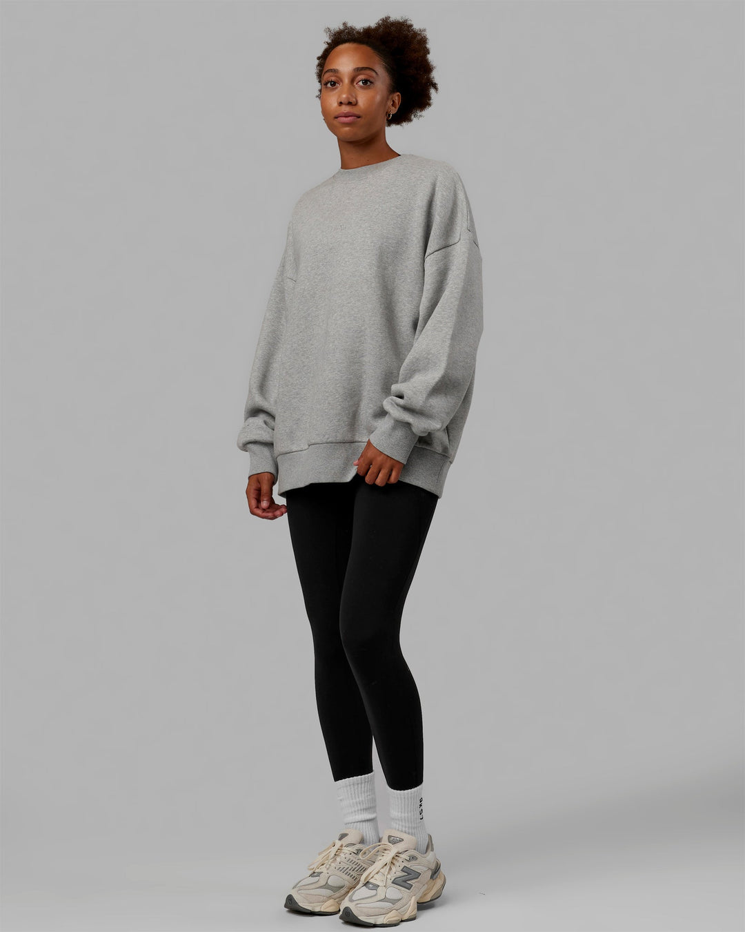 Woman wearing Unisex MVP Sweater Oversize - Lt Grey Marl