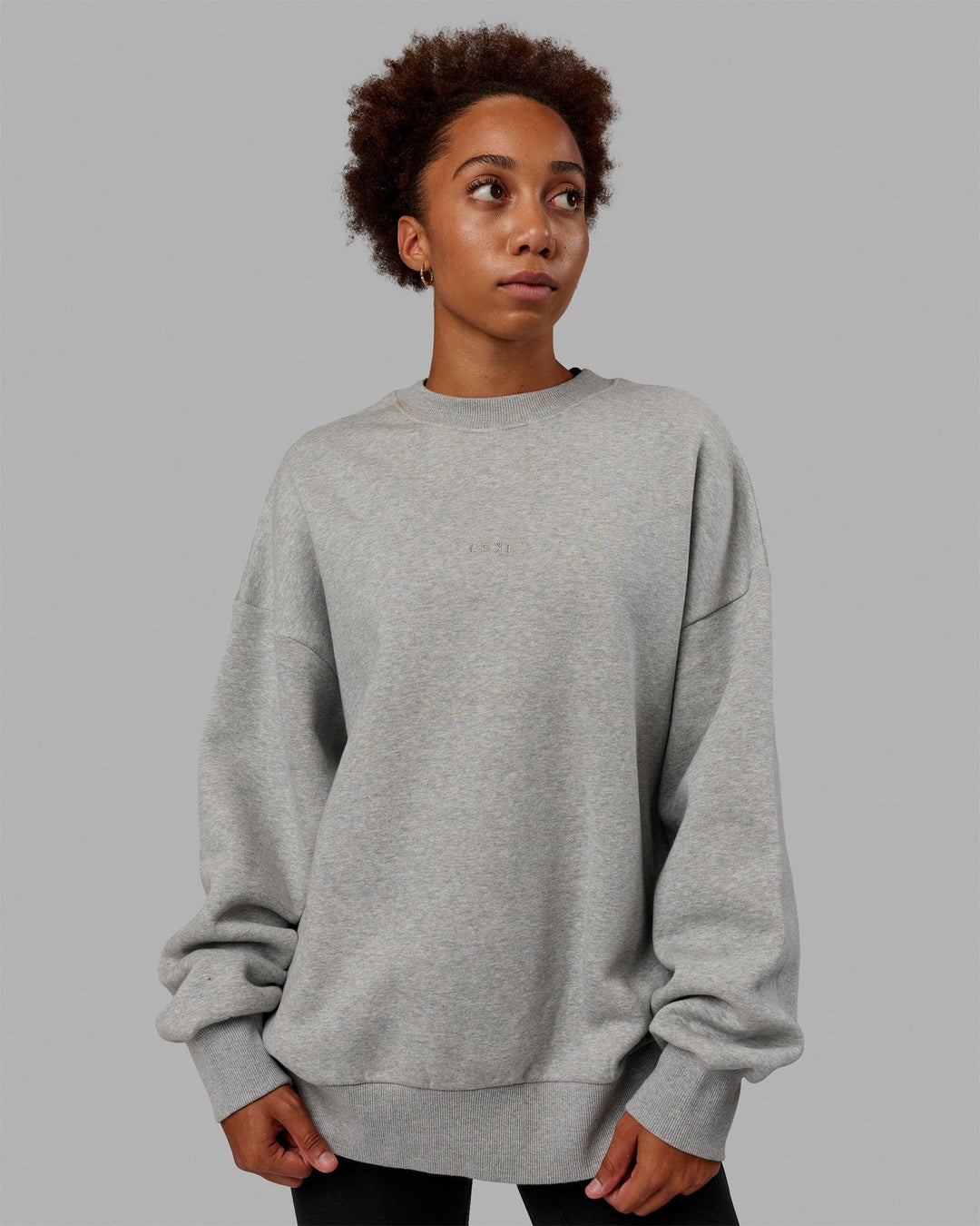 Woman wearing Unisex MVP Sweater Oversize - Lt Grey Marl