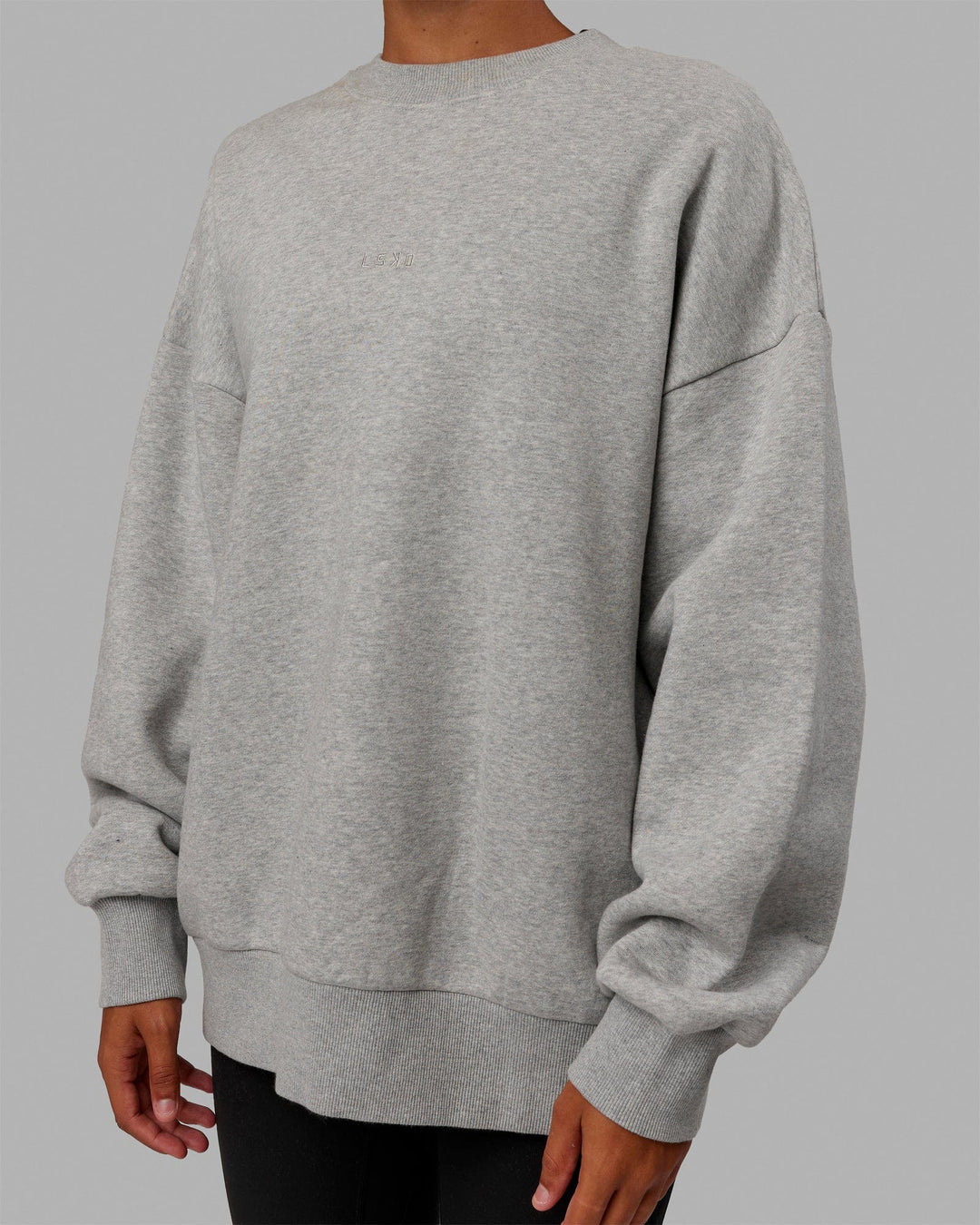 Woman wearing Unisex MVP Sweater Oversize - Lt Grey Marl