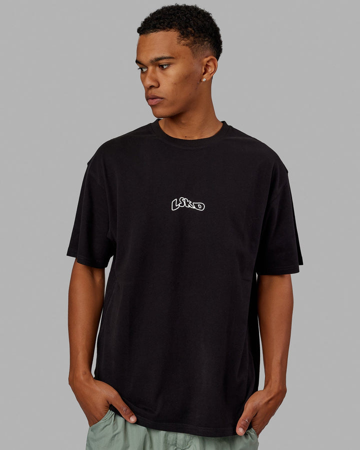 Man wearing Unisex Mad Happy Heavyweight Tee Oversize - Black