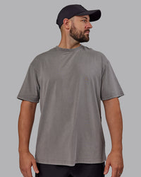 Man wearing Unisex Miami25 Washed FLXCotton Tee Oversize - Storm Front-Lemon Fizz