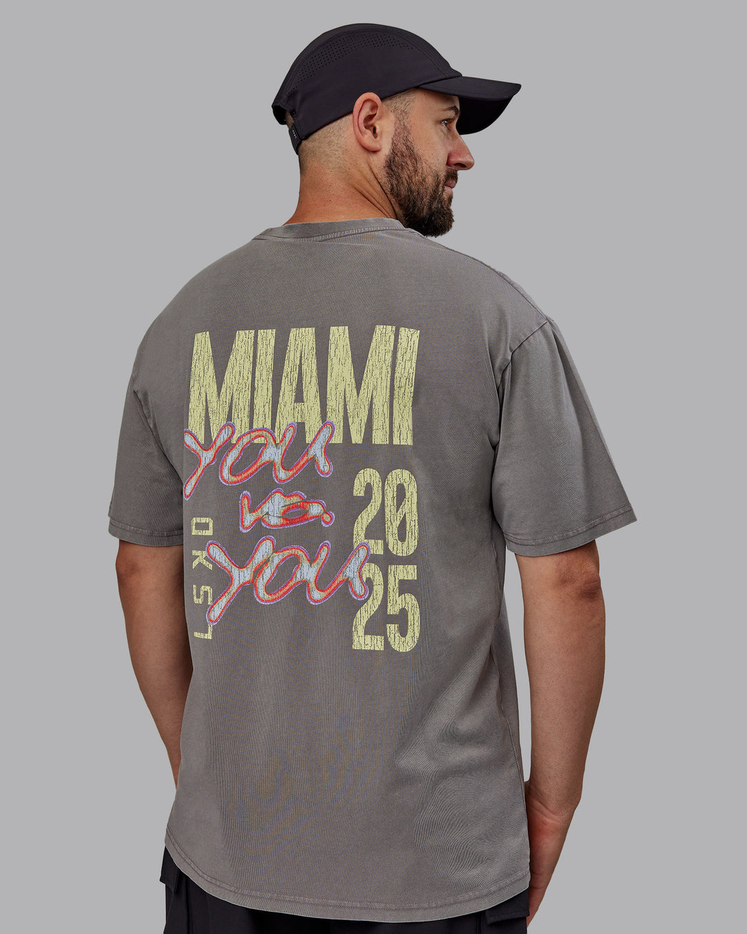 Man wearing Unisex Miami25 Washed FLXCotton Tee Oversize - Storm Front-Lemon Fizz