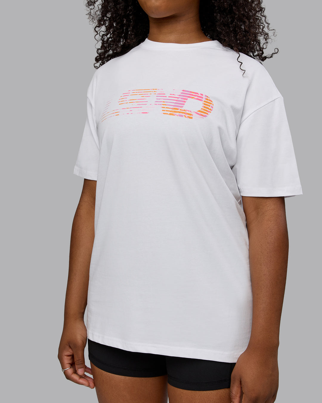 Woman wearing Unisex Motion FLXCotton Tee Oversize - White-React Print