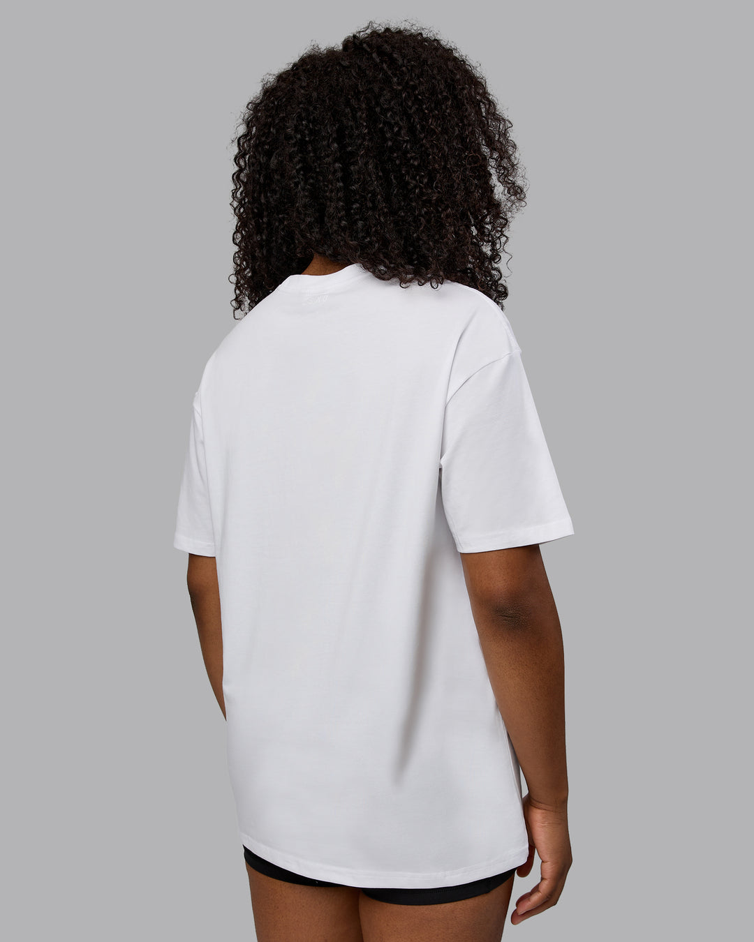Woman wearing Unisex Motion FLXCotton Tee Oversize - White-React Print