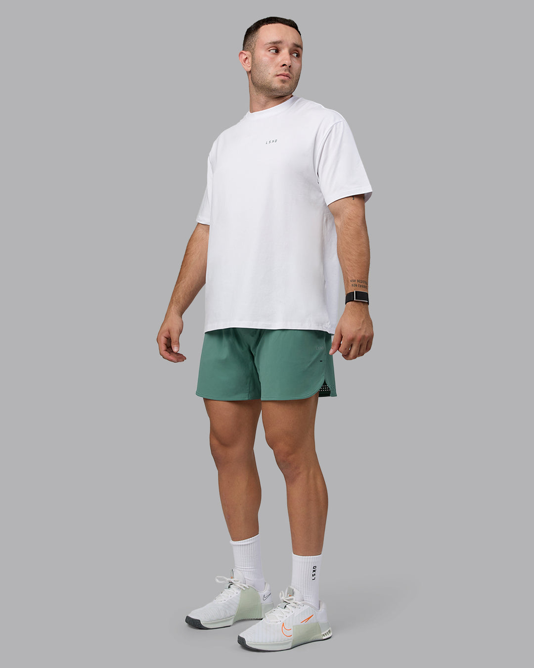 Man wearing Unisex Move Fast Value Series FLXCotton Tee Oversize - White-Sagebrush