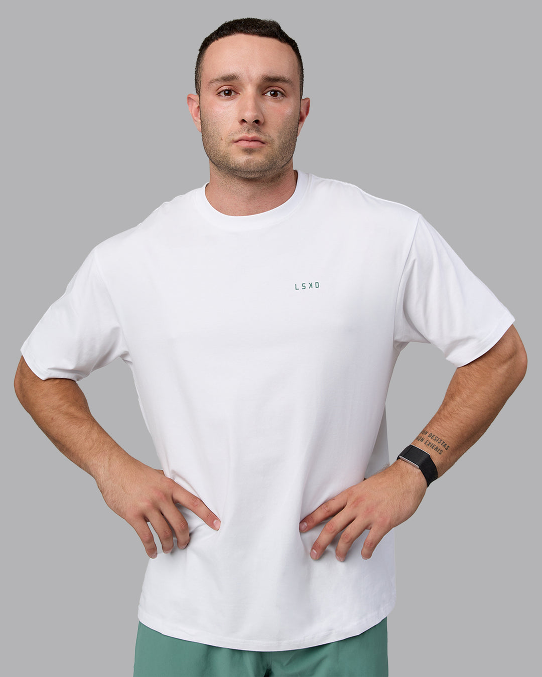 Man wearing Unisex Move Fast Value Series FLXCotton Tee Oversize - White-Sagebrush