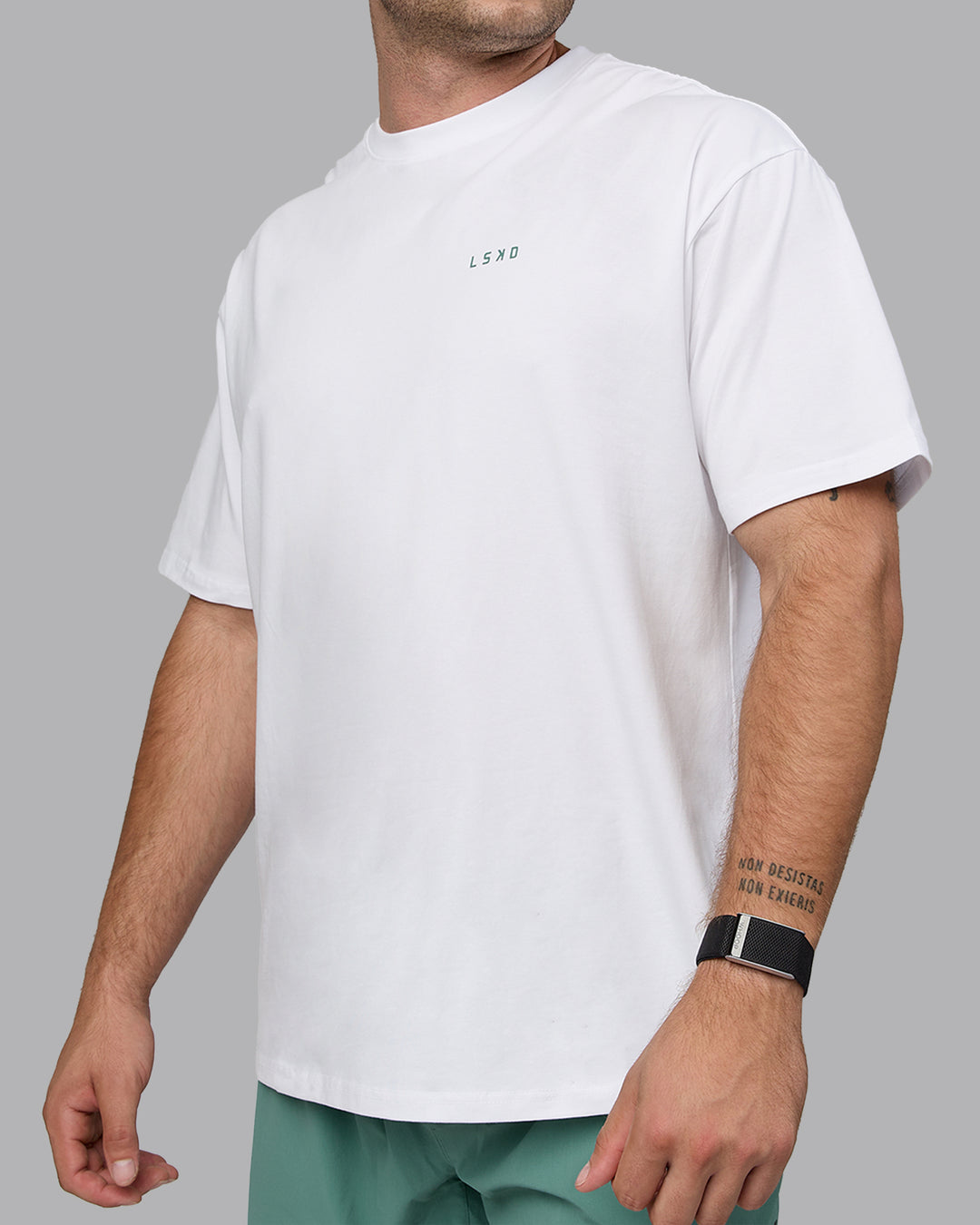 Man wearing Unisex Move Fast Value Series FLXCotton Tee Oversize - White-Sagebrush