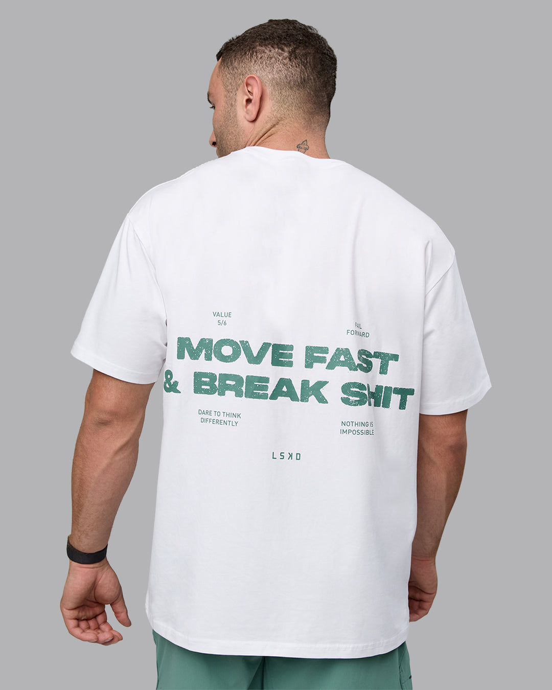 Man wearing Unisex Move Fast Value Series FLXCotton Tee Oversize - White-Sagebrush