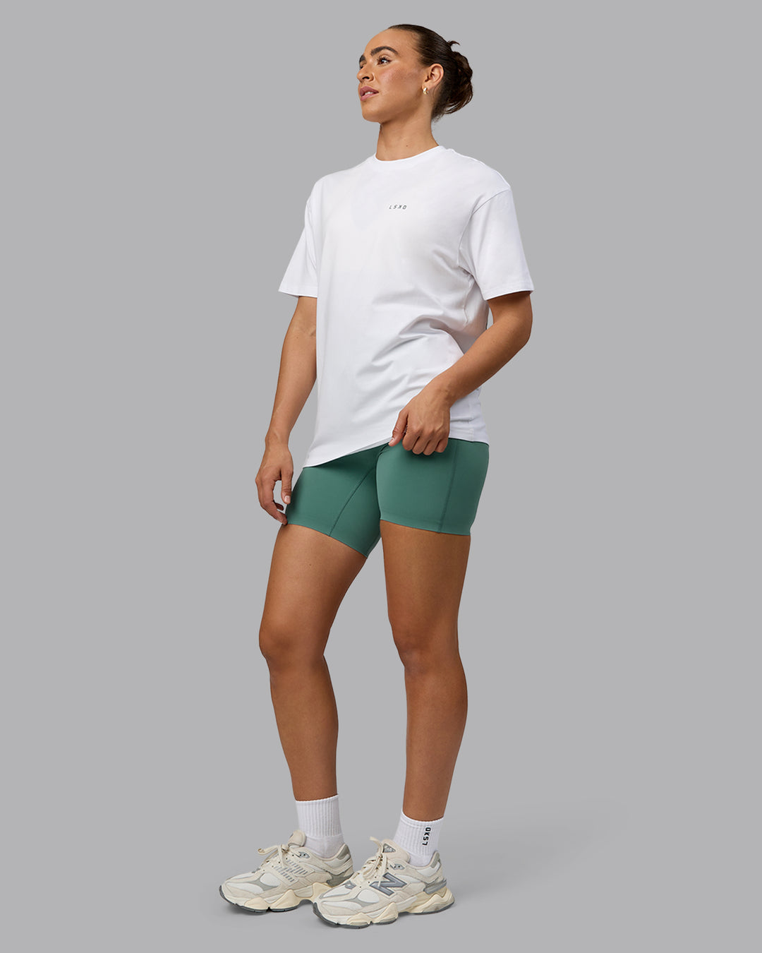 Woman wearing Unisex Move Fast Value Series FLXCotton Tee Oversize - White-Sagebrush