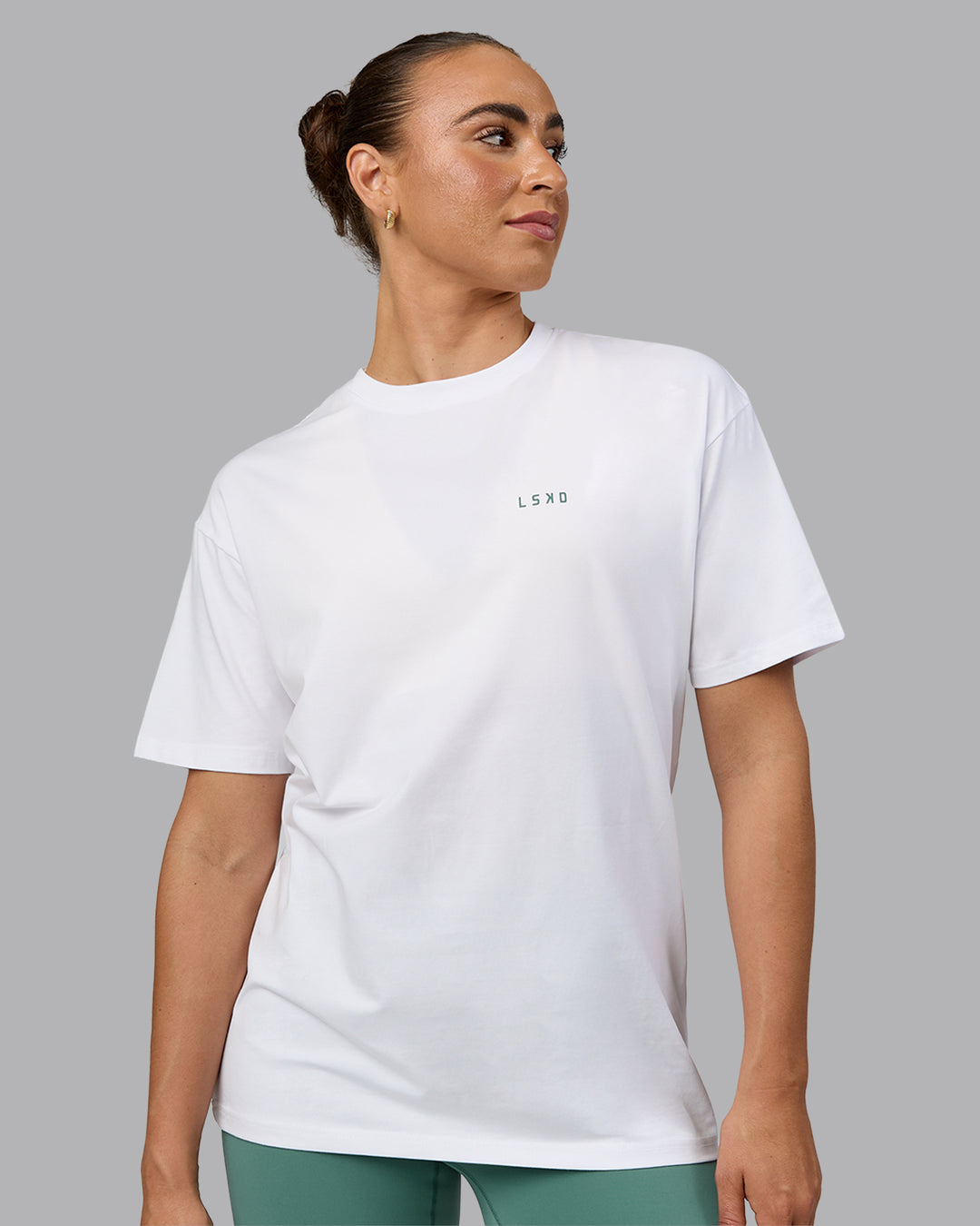 Woman wearing Unisex Move Fast Value Series FLXCotton Tee Oversize - White-Sagebrush