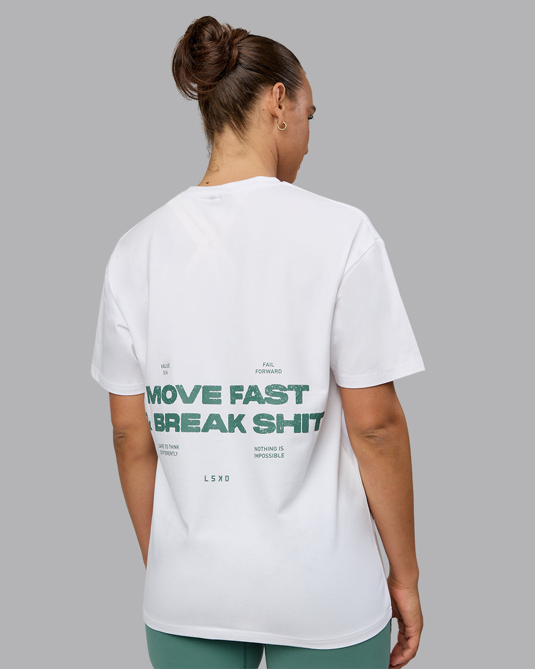 Woman wearing Unisex Move Fast Value Series FLXCotton Tee Oversize - White-Sagebrush