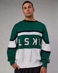 Man wearing Unisex PrimeTime Sweater Oversize - Malachite-White