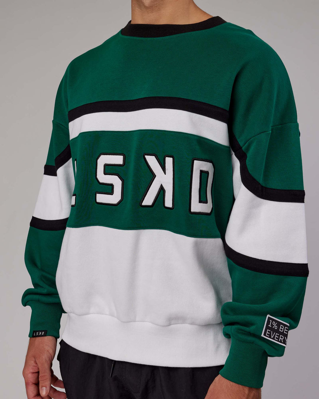 Man wearing Unisex PrimeTime Sweater Oversize - Malachite-White
