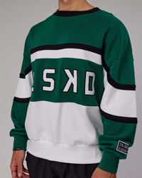 Man wearing Unisex PrimeTime Sweater Oversize - Malachite-White