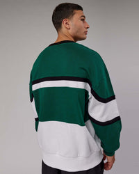 Man wearing Unisex PrimeTime Sweater Oversize - Malachite-White