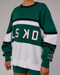 Woman wearing Unisex PrimeTime Sweater Oversize - Malachite-White