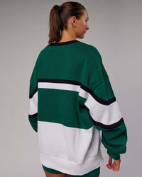 Woman wearing Unisex PrimeTime Sweater Oversize - Malachite-White