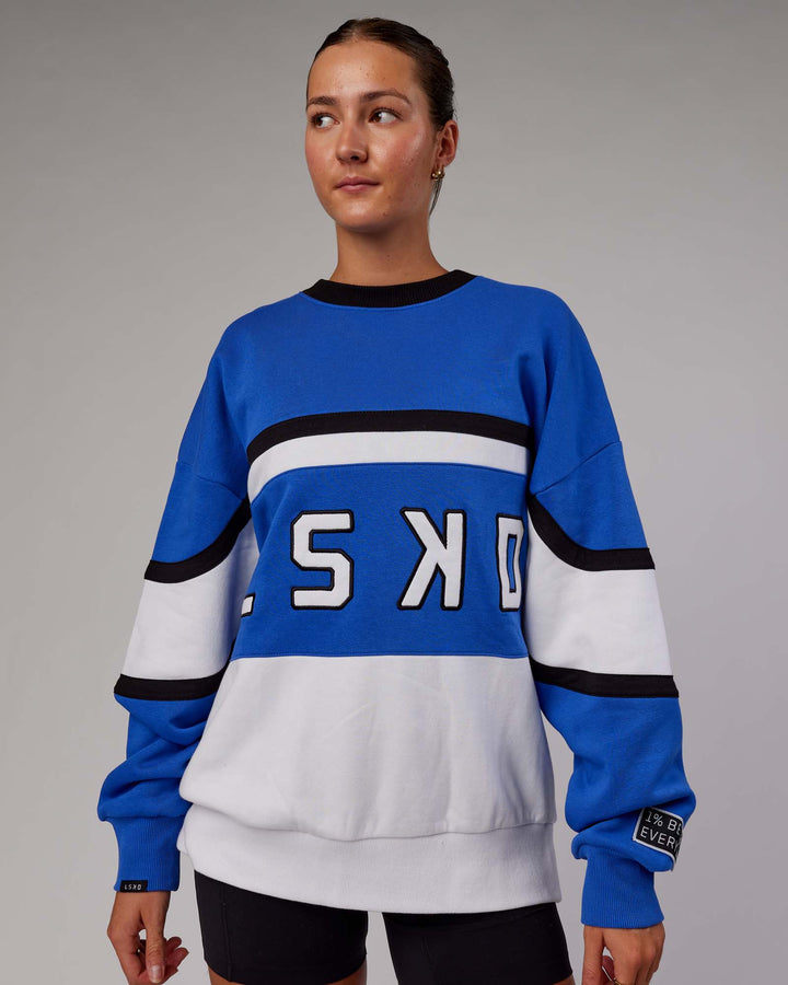 Woman wearing Unisex PrimeTime Sweater Oversize - Power Cobalt-White