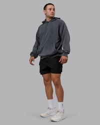 Man wearing Unisex Washed Set the Standard Hoodie Oversize - Black-Greyish Purple