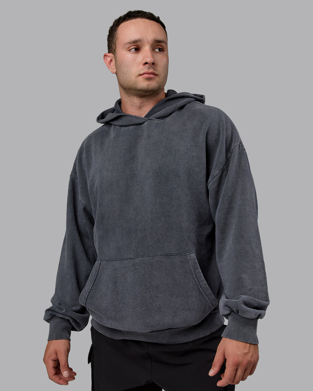 Man wearing Unisex Washed Set the Standard Hoodie Oversize - Black-Greyish Purple