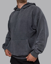 Man wearing Unisex Washed Set the Standard Hoodie Oversize - Black-Greyish Purple