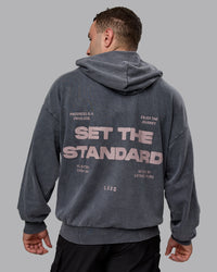 Man wearing Unisex Washed Set the Standard Hoodie Oversize - Black-Greyish Purple
