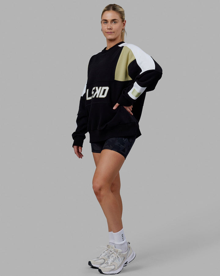 Woman wearing Unisex Slam Sweater Oversize - Black-Gold