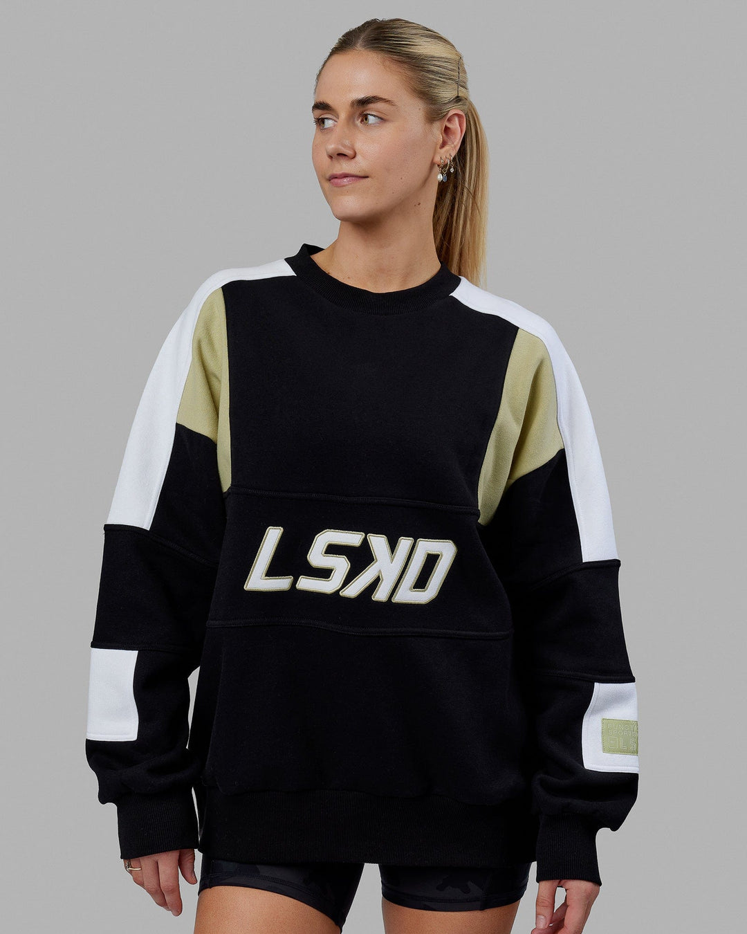 Woman wearing Unisex Slam Sweater Oversize - Black-Gold